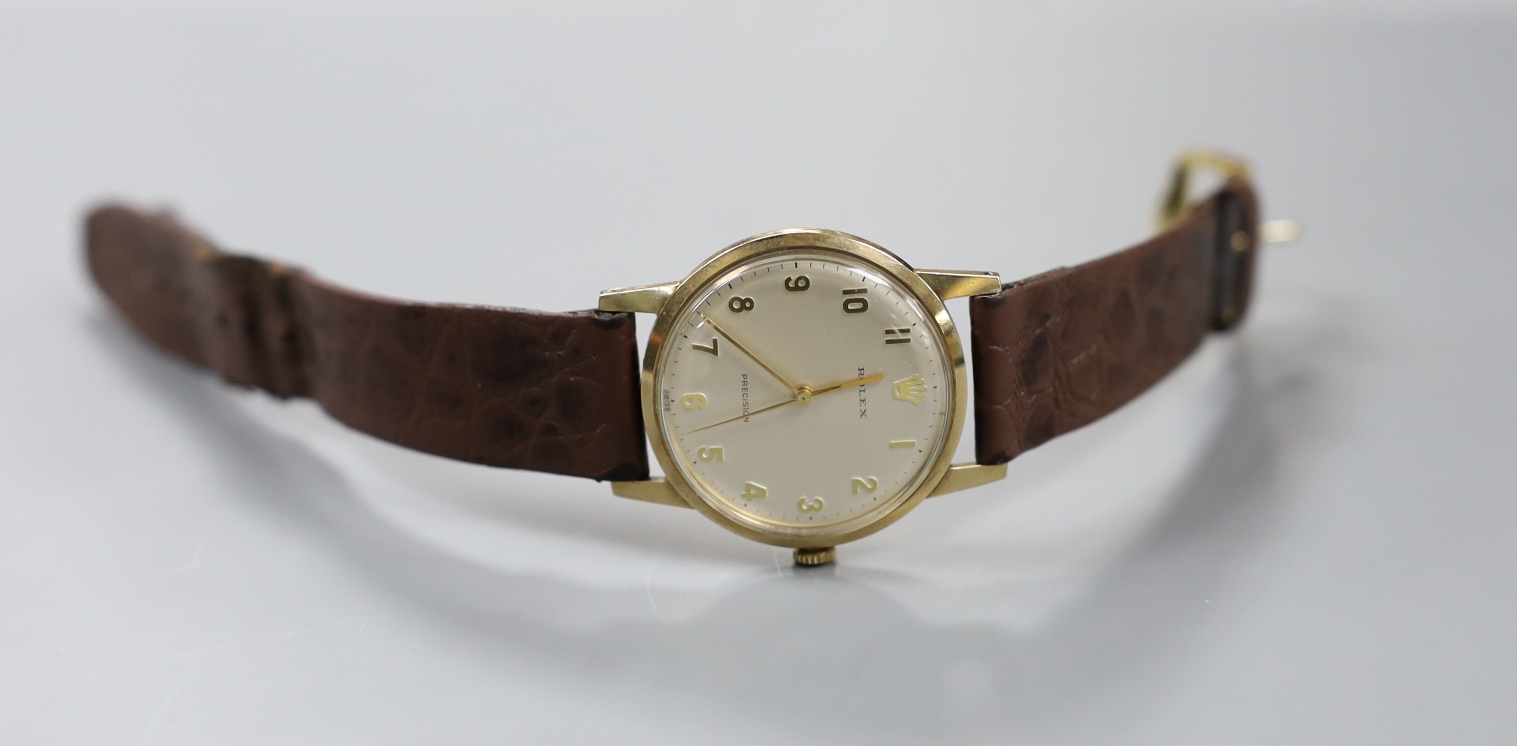 A gentleman's late 1960's 9ct gold Rolex precision manual wind wrist watch, with case back inscription, on associated leather strap, case diameter 34mm, gross weight 33.6 grams, with box and guarantee.